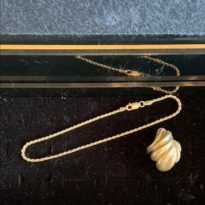 Sterling Silver swirl ring and Sterling Silver anklet.